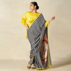 Another look from the Gulabo by Abu Sandeep shoot. The makeup remains consistent with a focus on elegant, defined features that work beautifully with the modern, graphic saree.