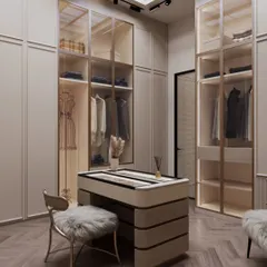 A walk-in wardrobe should feel like a personal boutique. I designed this space with soft beige tones and a central accessory island to feel warm and expansive. A faux skylight overhead floods the room with a natural, diffused glow, making the daily ritual of getting dressed feel like an airy and inviting indulgence.