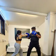 Practicing combinations on the pads. This drill helps build muscle memory, so you can react instinctively in a high-stress situation.