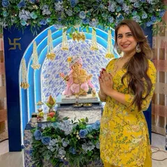 Presenting our colour of the season, 'Aqua Blue'. This Ganpati mandap features a stunning floral arch in shades of blue and white, with delicate hanging mogra strings. It's an elegant and fresh take on festive home decor.