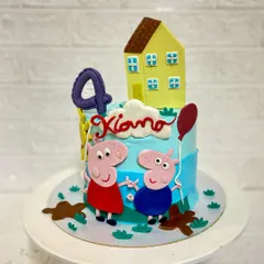 Oink oink. A fun Peppa Pig and George cake for a 4th birthday celebration. This chocolaty caramel cake is decorated with their house and muddy puddles, of course.