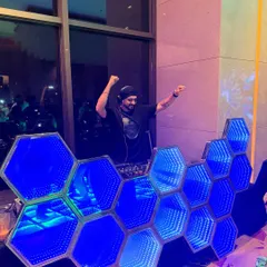 My custom hexagonal infinity mirror DJ booth is a real showstopper. It adds a unique and futuristic touch to this Marriott celebration.