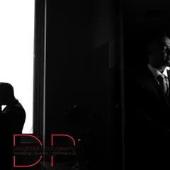 A creative black and white silhouette shot. This artistic approach uses light and shadow to create a moody and mysterious couple portrait.