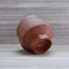 The base of the teabowl, showing the faceted foot and my signature from 2022. The details on the bottom of a pot are just as important as the rest.