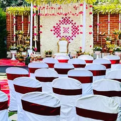 An identical view of the Seemantham guest seating, highlighting the beautiful floral stage in the background.