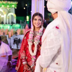 That look of love. A candid moment between the bride and groom during their wedding ceremony, with her makeup looking flawless and radiant.