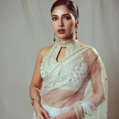 A close-up of Bhumi's ivory saree look, highlighting the intricate embroidery on the halter-neck blouse and the elegant, sheer fabric of the saree.