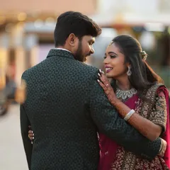 A beautiful moment between the couple. The bride's diamond jewellery sparkles, adding a touch of glamour to their reception look.