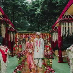 Here, the bride and groom take their first steps as a married couple down a stunning golden mirror aisle. Flanked by floral elephants and lush red arrangements, this moment captures the heart of a royal South Indian wedding, a journey beginning in beauty and tradition.