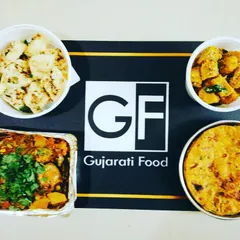 A typical special meal order can include a mix of dishes. Here you can see a complete spread with Undhiyu, Methi Thepla, and steamed Muthiya, packed and ready for you to enjoy.