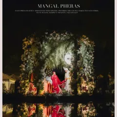 A breathtaking wide shot of the 'Mangal Pheras' by a poolside, the reflection in the water adding a layer of magic to this sacred ritual.
