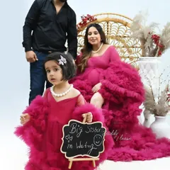A heartwarming family maternity photo celebrating the arrival of a new member. The older daughter holds a "Big Sister in Waiting" sign, showing how I love to include the entire family in these precious moments.