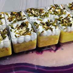 These are my Kesar Pista Tres Leches Cups, made specially for Rakhi. Each cup has a moist, saffron-infused sponge soaked in rich milk and topped with pistachios and edible gold leaf.
