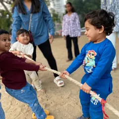 The face of pure determination and teamwork. Our parties are filled with moments like this, where kids learn to work together, challenge themselves, and have a blast doing it, like in this classic tug-of-war.