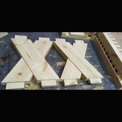 Here, the complex cross-lap joints for the bench legs are cut and ready. This type of joinery requires careful measurement and precise cutting to ensure a strong and stable base.