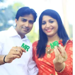 A fun and playful shot for a "save the date" or pre-wedding announcement. Using props like these "Mr" and "Mrs" letters adds a touch of personality and excitement to the photoshoot.
