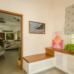 The foyer was redesigned to be a welcoming threshold. The bench and storage unit were crafted from the house's old teak doors, an example of our commitment to upcycling and preserving the history of a space.