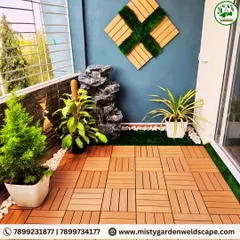 Another view of the Kudlu Gate balcony, showing how the water fountain, plants, and decorative wall art come together to create a beautiful and personalized small space.
