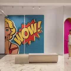 A tile showroom where tiles are for furniture, walls, and making you say "Wow!" I creatively displayed every product to spark imagination, with a pop-art mural and a tile-clad bench.