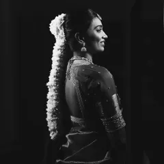 The same portrait in black and white, emphasizing the classic beauty and form of the look.