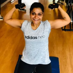 Strength and confidence shining through. This client is showing off the muscle she built through our personal training sessions.