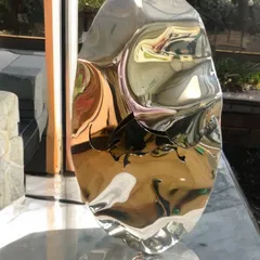 From my Bull Series, this freestanding sculpture in polished stainless steel features an engraved bull. The distorted reflections on the curved surface give the powerful figure a sense of fluid motion.