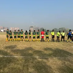 The Jamia Millia Islamia football team stands united for the national anthem before a match. Managing our teams for away tournaments, like this one in Phagwara, is a key part of my role.
