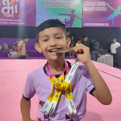 This smile says it all. The joy of achievement after months of discipline and practice is priceless. We don't just train gymnasts; we build champions who wear their hard-earned medals with pride.