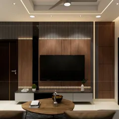 A bespoke TV unit that combines wood paneling with a sleek, floating console. The integrated shelving and backlighting turn a functional piece into a design statement.