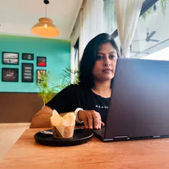 A candid shot of me working from a cafe. This photo captures a moment of reflection and surrender, embracing the unanswered questions that come with growth and change.