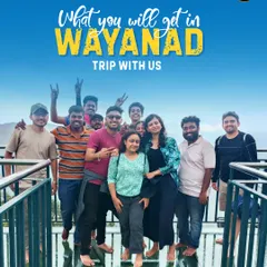 What you get on a Wayanad trip with us. A happy group posing on the iconic glass bridge at 900 Kandi.