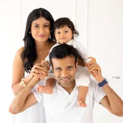 The classic family portrait, reimagined. We guide you into comfortable, natural poses that let your family's love shine through, creating timeless images against a clean, minimalist backdrop. This is a perfect example of our natural light family sessions.