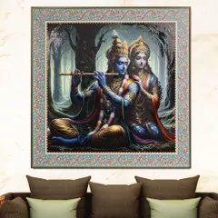 This 'Whispers of Love' painting captures a serene moment between Radha and Krishna in a forest. The fabric embossing gives the artwork a beautiful 3D texture, and the intricate border adds to its divine charm.