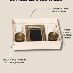 This is our Feraha gift box, a perfect Diwali hamper. It includes a Rehan photo frame in a gold antique finish and a pair of ribbed candle holders.