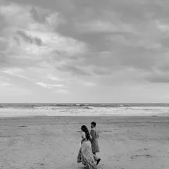 In the quiet moments after the chaos of Haldi, they walked along the shore. The world faded into soft grey tones, leaving only the sound of the waves and the feeling of their hands intertwined. This is the poetry I seek, the unscripted symphony of two people simply being together.