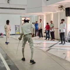 A live sparring session on the fencing piste. This is where fencers test their skills, strategy, and mental toughness in a competitive bouting environment.