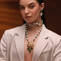 Another look from the same campaign, showing versatility. The makeup remains clean and radiant, allowing different sets of jewelry to be showcased effectively.