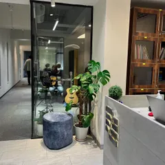 A peek down our hallway. You can see one of our lesson rooms where students get one-on-one instruction. Our space is clean, modern, and filled with music.