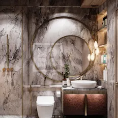 This elegant bathroom combines textured marble walls with statement double-ring mirrors and warm, woven-front cabinetry. The design feels both opulent and earthy, creating a unique, spa-like atmosphere.