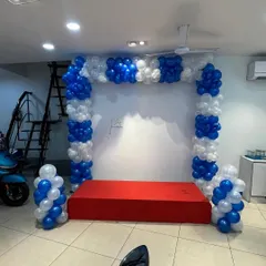 Another view of the showroom decoration, with a red carpeted stage.