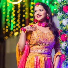 The bride is glowing against the festive lights. My Haldi makeup is designed to be waterproof and long-lasting, so it stays perfect throughout the ceremony.