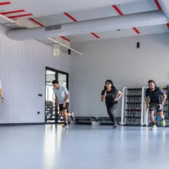 Participants in the UKSCA course practice agility and speed assessments under the watchful eye of certified trainers.