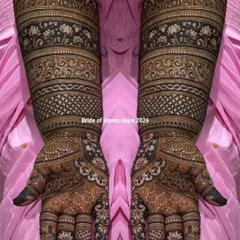 A classic band-style bridal mehendi. This design features structured layers of traditional patterns, including florals and jaali work, creating a look of perfect symmetry and rich detail.
