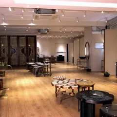 The Ghitorni showroom is a source of inspiration, with various setups including vanities, tables, and decorative screens to spark ideas.