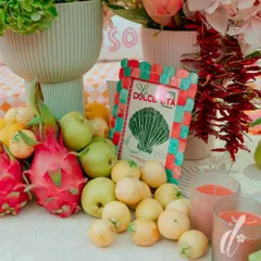 We love using natural, unexpected elements. Here, a mix of fresh dragon fruit, pears, and guavas adds color, texture, and a sense of abundance to the table decor.