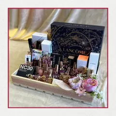 For the makeup lover in your life. This tray is packed with premium beauty products from brands like Lancôme, MAC, and Huda Beauty, creating a luxurious and impressive gift for any occasion.