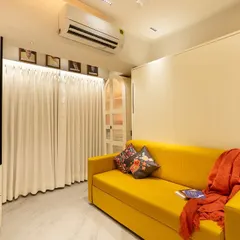 With the wall bed folded up, the room transforms into a cozy living area or office space. This is the kind of smart, flexible design we love to create for our clients.