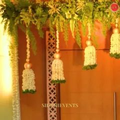 A close-up of our handcrafted floral tassels, known as 'latkans'. Made from fragrant white flowers, these beautiful details are hung from doorways and ceilings to add a touch of traditional elegance and charm to the decor.