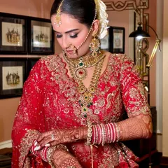 A classic bridal portrait of my bride Anushree. The focus is on her flawless skin, soft smokey eyes, and the beautiful details of her red lehenga and traditional jewellery.