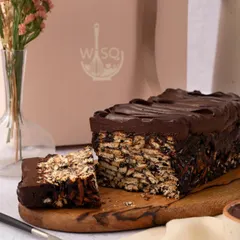 Our take on the classic chocolate biscuit cake. This rich, no-bake dessert features layers of crushed biscuits and decadent chocolate, perfect for satisfying any sweet craving.